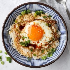 rice bowl with fried egg, sesame oil and soy sauce