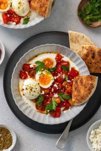 breakfast bowl with poached eggs, labneh and spices